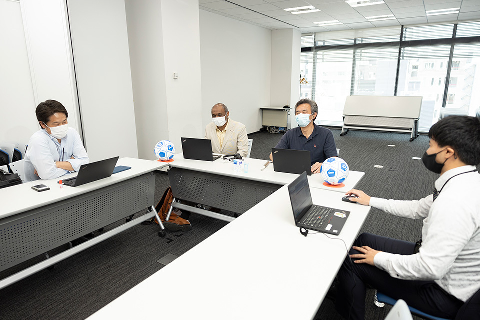 Abdin participating in a meeting in his office at Santen Pharmaceutical. Santen has a clear vision to realize an inclusive society in which people with and without visual impairment play equal roles. 