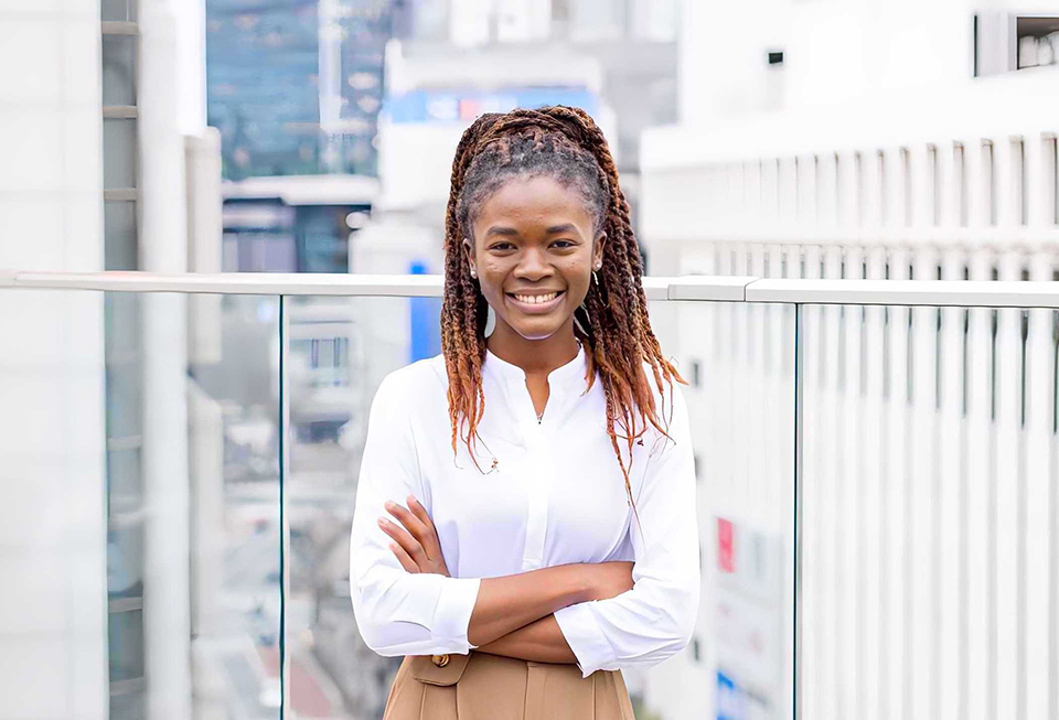 Upper body shot of Mary Yeboah Asantewaa smiling.