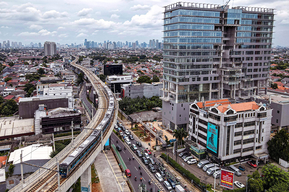 A train of Jakarta Mass Rapid Transit System running on elevated railway, in Indonesia.