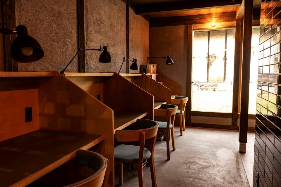 A coworking space in a former traditional kominka house, with elegant wooden desks