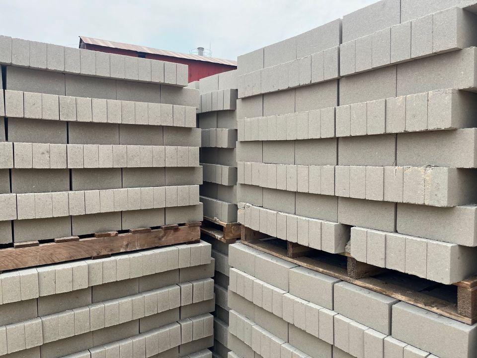 Stacks of gray non-fired bricks
