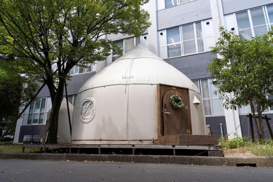 An Instant House with a wooden door and round side window