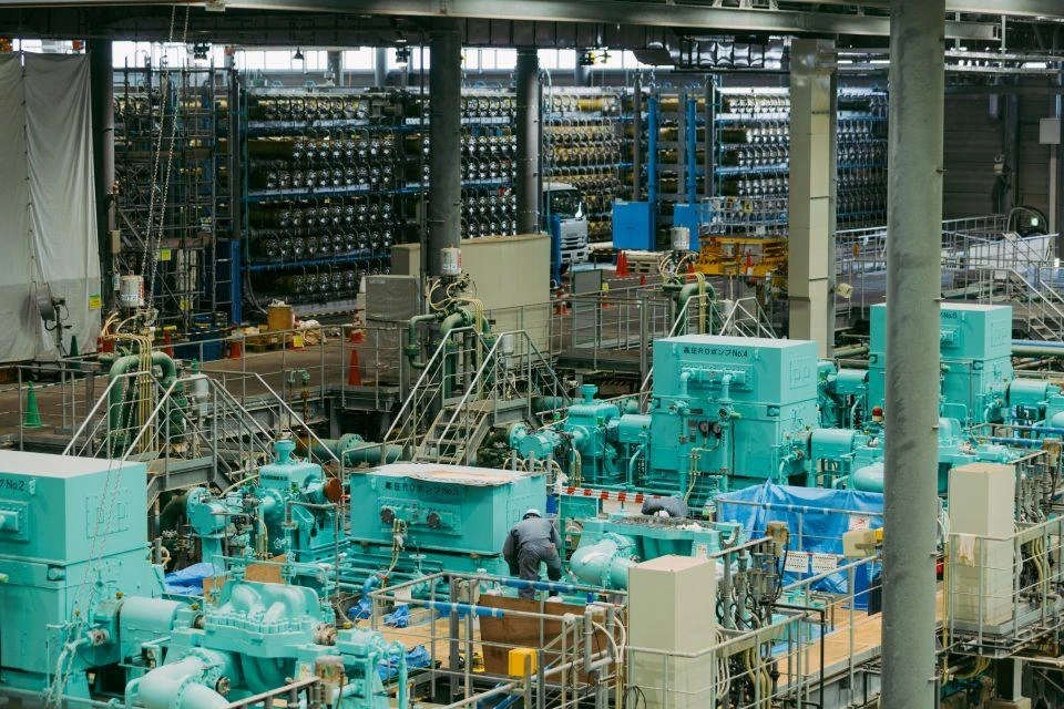 The turquoise-colored desalination machinery inside the Mamizupia Seawater Desalination Plant