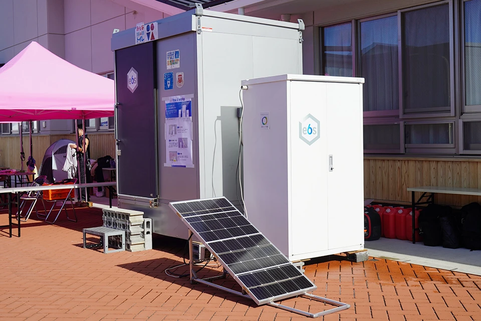 A portable toilet entirely powered by a small solar panel.